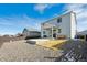 Spacious backyard with a patio, gravel, and a fenced perimeter, great for outdoor activities at 131 S Vandriver Way, Aurora, CO 80018