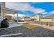 Backyard featuring a covered patio, a seating area, and rock landscaping at 131 S Vandriver Way, Aurora, CO 80018