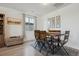 Cozy dining room featuring a wooden table set, a window with natural light, and stylish decor at 131 S Vandriver Way, Aurora, CO 80018