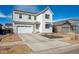 Attractive two-story home featuring a two-car garage, a well-kept lawn, and appealing curb appeal at 131 S Vandriver Way, Aurora, CO 80018