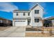 Charming two-story home with a two-car garage and a well-maintained front yard landscape with decorative rock at 131 S Vandriver Way, Aurora, CO 80018