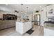 Modern kitchen featuring an island with granite countertops, stainless steel appliances, and an open layout at 131 S Vandriver Way, Aurora, CO 80018