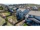 Aerial view of a large backyard with patio, fire pit, and stone walkway at 2881 Black Canyon Way, Castle Rock, CO 80109