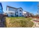 Large backyard with pergola over patio and stone firepit at 2881 Black Canyon Way, Castle Rock, CO 80109