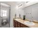 Bright bathroom features a double sink vanity, large mirror and separate toilet and shower areas at 2881 Black Canyon Way, Castle Rock, CO 80109