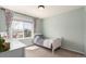 Cozy bedroom with a large window providing natural light and neighborhood views at 2881 Black Canyon Way, Castle Rock, CO 80109