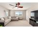 Bonus room features a large window, a comfortable sectional, and a functional entertainment center at 2881 Black Canyon Way, Castle Rock, CO 80109