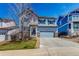 Charming two-story home with a well-maintained lawn and a two-car garage on a clear, sunny day at 2881 Black Canyon Way, Castle Rock, CO 80109