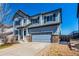 Two-story home featuring a two-car garage, neutral siding, and a well-kept lawn at 2881 Black Canyon Way, Castle Rock, CO 80109