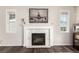 Close up on an elegant fireplace with white stone surround at 2881 Black Canyon Way, Castle Rock, CO 80109