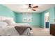 Spacious bedroom with ceiling fan, plush carpeting and a window with scenic views at 2881 Black Canyon Way, Castle Rock, CO 80109