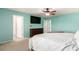 Inviting main bedroom with ceiling fan, carpet, and ensuite bathroom at 2881 Black Canyon Way, Castle Rock, CO 80109