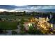 Aerial view of vast property with pool, spa, outdoor fireplace, and stately home at 15355 Zuni St, Broomfield, CO 80023