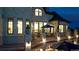 Elegant stone balcony with comfortable seating overlooking the pool and beautifully landscaped grounds at 15355 Zuni St, Broomfield, CO 80023