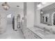 Bright bathroom with marble countertops, tiled floors, and stylish fixtures at 15355 Zuni St, Broomfield, CO 80023