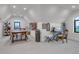 Bright craft room with great natural light and ample space for multiple crafting workstations at 15355 Zuni St, Broomfield, CO 80023