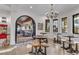 Open dining area with light-filled windows and views of the connected home theatre and bar area at 15355 Zuni St, Broomfield, CO 80023