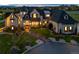 Stunning stone home featuring lush landscaping, manicured lawn and beautiful brick walkway leading to the front entrance at 15355 Zuni St, Broomfield, CO 80023