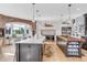 Bright kitchen features butcher block island, breakfast nook, brick accent wall and modern appliances at 15355 Zuni St, Broomfield, CO 80023