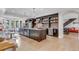 Spacious kitchen featuring a large island, brick accents, and barstool seating, perfect for entertaining guests at 15355 Zuni St, Broomfield, CO 80023