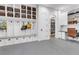 Well-organized mudroom with built-in bench, storage, and access to pantry and office area at 15355 Zuni St, Broomfield, CO 80023