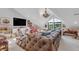 Large playroom features a window with a beautiful view, a tv and tufted leather couch at 15355 Zuni St, Broomfield, CO 80023
