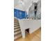 Recreation room showcasing a climbing wall, basketball hoop, foam pit, and carpeted staircase at 15355 Zuni St, Broomfield, CO 80023