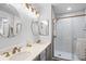 Bathroom featuring double sink vanity, with a subway tile shower in a private room at 474 Black Feather Loop # 419, Castle Rock, CO 80104