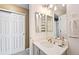 Bathroom featuring updated vanity with modern fixtures, and decorative mirror at 474 Black Feather Loop # 419, Castle Rock, CO 80104
