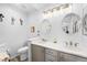 Bright bathroom features double sinks with quartz countertops and modern lighting fixtures for a spa-like feel at 474 Black Feather Loop # 419, Castle Rock, CO 80104