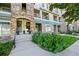 Exterior view of the condo featuring stone accents, a well-manicured lawn, and a welcoming entrance at 474 Black Feather Loop # 419, Castle Rock, CO 80104