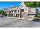 Well-kept building exterior featuring a combination of stone and siding, with ample parking at 474 Black Feather Loop # 419, Castle Rock, CO 80104
