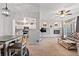 Stylish living space showcasing an open layout with views to the dining area and a modern fireplace at 474 Black Feather Loop # 419, Castle Rock, CO 80104