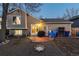 Backyard featuring gravel and stone landscaping, small patio, grill, and view of home's exterior at 9333 Cattail Ct, Highlands Ranch, CO 80126
