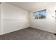 Bedroom boasts neutral carpet and a large window for natural light at 9333 Cattail Ct, Highlands Ranch, CO 80126
