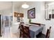 Dining room featuring a modern table set and connection to the kitchen at 9333 Cattail Ct, Highlands Ranch, CO 80126