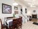 Open-concept dining area with view of staircase and fireplace at 9333 Cattail Ct, Highlands Ranch, CO 80126