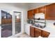Kitchen with access to outdoor area and standard appliances at 9333 Cattail Ct, Highlands Ranch, CO 80126