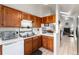 Well-maintained kitchen with wood cabinets and white countertops at 9333 Cattail Ct, Highlands Ranch, CO 80126