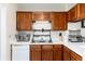 Functional kitchen with wood cabinets and a double sink at 9333 Cattail Ct, Highlands Ranch, CO 80126