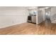 Laundry area with modern appliances and staircase access, illuminated by recessed lighting at 9333 Cattail Ct, Highlands Ranch, CO 80126