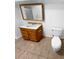 Bathroom with a vanity, toilet and mirror at 2685 S Dayton Way # 326, Denver, CO 80231