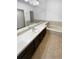 Bathroom features a bathtub and dark brown vanity at 2685 S Dayton Way # 326, Denver, CO 80231