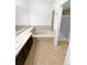 Bathroom includes a bathtub and dark brown vanity at 2685 S Dayton Way # 326, Denver, CO 80231