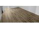 Simple bedroom with hardwood floors and an adjacent door at 2685 S Dayton Way # 326, Denver, CO 80231