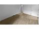 Simple bedroom with hardwood floors and an adjoining door at 2685 S Dayton Way # 326, Denver, CO 80231