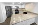 Modern kitchen features granite countertops and stainless steel appliances at 2685 S Dayton Way # 326, Denver, CO 80231