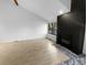Living room with fireplace and wood-look floors at 2685 S Dayton Way # 326, Denver, CO 80231