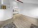 Open living room with vaulted ceiling and kitchen view at 2685 S Dayton Way # 326, Denver, CO 80231