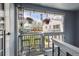 Balcony showing outdoor seating, hanging plants, and a view of the yard and surrounding neighborhood at 7984 Chase Cir # 68, Arvada, CO 80003